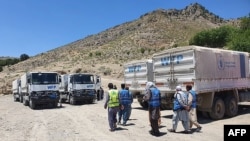 تصویر آرشیف: کارمندان و وسایط امداد رسانی برنامه جهانی غذا در افغانستان 