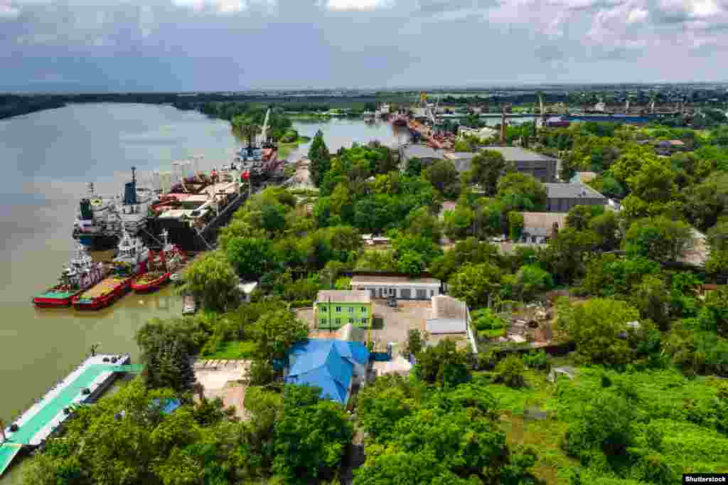 A file photo of a port in Izmayil, Ukraine. Romanian territory can be seen at left, across the Danube River, the natural boundary between the two countries. On September 7, the Romanian Defense Ministry&nbsp;released a statement condemning the Russian attack on the Ukrainian port, then declared the kamikaze drone strikes on Ukraine &ldquo;did not pose any direct military threats against our national territory.&rdquo;