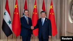 Китайський лідер Сі Цзіньпін з поваленим президентом Сирії Башаром Асадом під час державного візиту до Китаю у 2023 році