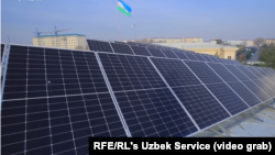 Solar panels are seen atop a building in Tashkent in February 2024.