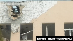 Пошкоджена російськими обстрілами будівля у селі Антонівка, Херсонська область, Україна, лютий 2023 року. Фото ілюстративне