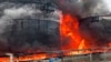 RUSSIA – Oil tanks are seen on fire after the drone attack in Klintsy, a city in Russia’s Bryansk region, about 60 kilometers (40 miles) from the Russia-Ukrainian border, January 19, 2024