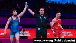 Тайырбек Жумашбек уулу финалда кытайлык Лиу Мингуну (кызыл кийимчен)менен беттешти. Астана шаары. 14-апрель, 2023-жыл.