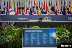 Монітор під час пленарного засідання Саміту з питань миру в Україні. Швейцарія, 16 червня 2024 року