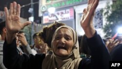 Рамалла шаарында көчөгө чыккан палестин аял. 31-октябрь, 2023-жыл. 
