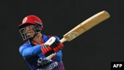 مجیب الرحمن یک تن از بازیکنان شناخته شده تیم ملی کریکت افغانستان در یک مسابقه در مقابل پاکستان - عکس از آرشیف