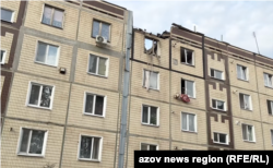 Наслідки російського обстрілу по багатоповерхівках Нікополя