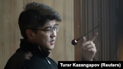 Quandyq Bishimbaev is accused of viciously beating his wife to death in a restaurant in November.