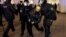 Полиция задерживает участницу протеста против российского вторжения в Украину. Санкт-Петербург, 1 марта 2022 года