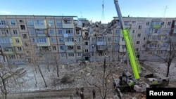 Харьковта снаряд эләгү нәтиҗәсендә җимерелгән йорт