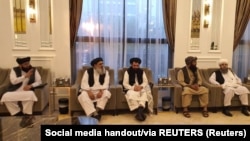 Taliban delegates meet with Qatari delegates in Doha. 