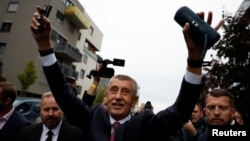 The leader of the ANO party, Andrej Babis, celebrates as he reacts to the preliminary results of parliamentary elections, in Prague on October 4. 