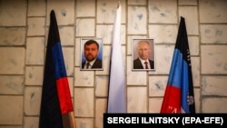 Портрети Дениса Пушиліна та Володимира Путіна в одній з адмінбудівель окупованого Донецька