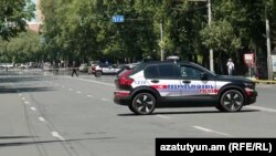 Armenia - Police cars parked on Yerevan's Marshal Bagramian Avenue blocked by relatives of missing soldiers, June 19, 2025. 