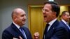 Premierul Olandei Mark Rutte reacționează când se întâlnește cu președintele Bulgariei, Rumen Radev, în timpul summitului liderilor Uniunii Europene de la Bruxelles, Belgia.