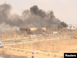 Clouds of smoke rise from the restive Kazakh town of Zhanaozen in this still image taken from video acquired by Reuters TV on December 16, 2011.