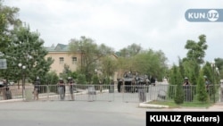 Uzbek law enforcement officers guard a street in Nukus, the capital of the Karakalpakstan region, on July 3, 2022.