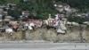 Flood-damaged buildings along the Swat River in Pakistan. 