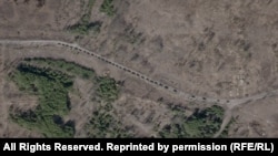 Колона російської бронетехніки поблизу забрудненого радіацією так званого «рудого лісу» неподалік ЧАЕС. 16 березня 2022 року