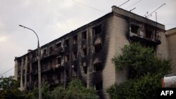 Imagine generică cu rămășițele unui bloc după ce a fost lovit de o rachetă. 