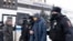 Police detain a participant of the Municipal Russia conference in Moscow on March 13.