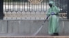 A worker disinfects a street in front of the parliament in Bishkek as Kyrgyzstan battles the coronavirus.