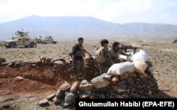 Afghan security forces conduct an operation against suspected militants in the Sherzad district of Nangarhar Province on March 8.