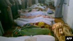 A video grab allegedly shows bodies of men who were killed in a reported massacre in the village of Tremseh.
