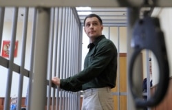 Trevor Reed in the defendants' cage at a Moscow court hearing earlier this year.