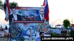 Tartus liman şəhərində Bəşər Əsədin və Vladimir Putinin plakatı. 2022