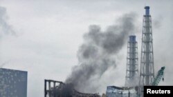 Smoke rises from the area of the No. 3 reactor at the Fukushima Daiichi plant