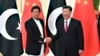 Chinese President Xi Jinping (right) shakes hands with Pakistani Prime Minister Imran Khan before a meeting in Beijing in April 2019.