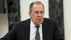 Ministrul Rusiei de Externe, Serghei Lavrov, în timpul unei întâlniri cu președintele Rusiei, Vladimir Putin, de pe 14 februarie 2022 din Moscova, Rusia.