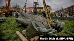 The monument to World War II Soviet Marshal Ivan Konev lies on the ground after being removed from its pedestal in Prague on April 3.