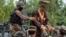 FILE: Afghanistan's National Directorate of Security (NDS) agents escort alleged Taliban and Islamic State (IS) fighters after they are presented to the media in Jalalabad on May 23.