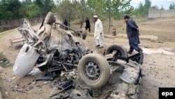 FILE: Security officials inspect the site of a bomb attack in Bajaur tribal region.