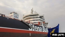 An image grab from Iranian Broadcasting on July 22 shows the Iranian Revolutionary Guards Corps patrolling the oil tanker Stena Impero anchored off the Iranian port city of Bandar Abbas. 