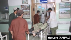 The victims of a roadside bombing in Zabul Province are brought to a hospital on May 10.