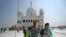 Sikh pilgrims at the Gurdwara Darbar Sahib in Kartarpur on September 22. The Pakistani site is so close to the border that its white dome and four cupolas can be seen from India.
