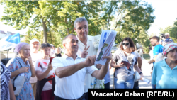 Moldovans take part in an election discussion ahead of the country's parliamentary vote on September 28. 