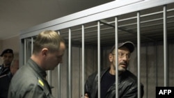 Dmitry Litvinov (right) faced a court in Murmansk on September 26.