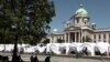 White tents in front of Serbian Parliament
