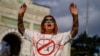 A woman wears a T-shirt bearing the word "Execution" in Persian as she takes part in a rally in Istanbul, Turkey, in November 2022.