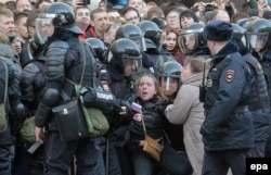 A young demonstrator is arrested by Russian riot police during an opposition rally in central Moscow on March 26.