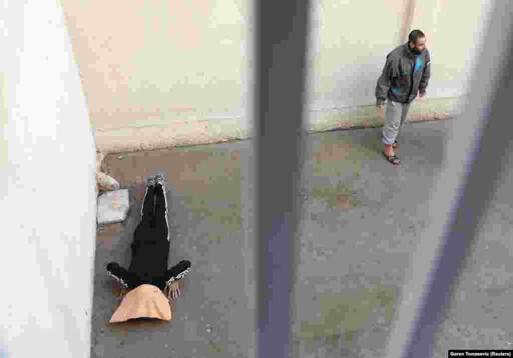 A suspect exercises in a prison in Hasaka, Syria.