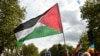 A protester waves a Palestinian flag during a march asking for the "recognition of the State of Palestine and the end of the genocide", in Paris on September 21, 2025.