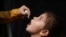 An Afghan girl is vaccinated during a polio-eradication campaign in Kabul on August 24.
