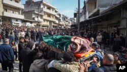 ادلیب، د مارچ اتمه- په لاذقیه کې د څلورو وژل شویو امنیتي ځواکونو د جنازې مراسم