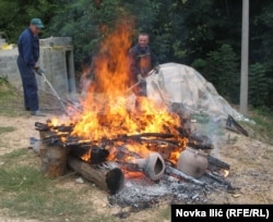 Pots being fired outdoors.
