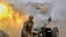 NAGORN-KARABAKH -- A serviceman of Karabakh's Defence Army fires an artillery piece towards Azeri positions during fighting, September 28, 2020.